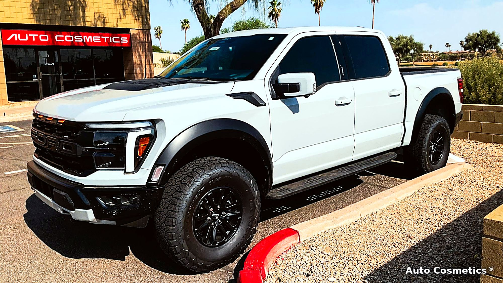 White Ford F-150 Raptor outside Auto Cosmetics in Chandler, Arizona