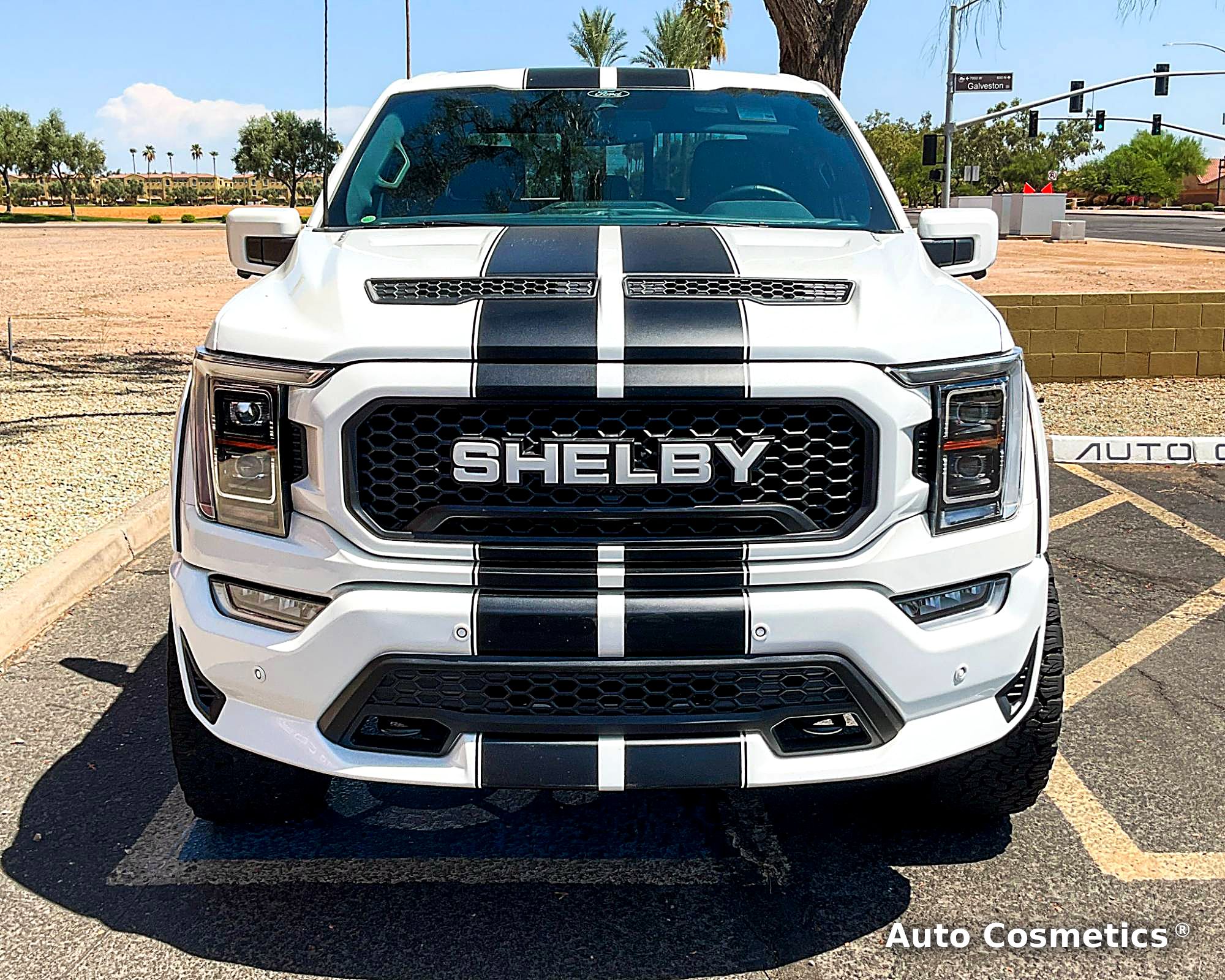 White Ford F-150 Shelby with racing stripes at Auto Cosmetics in Chandler, Arizona